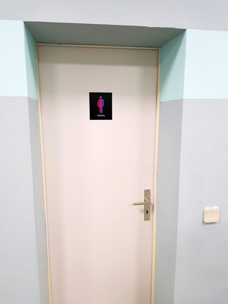 Unisex toilet with CO-WC sign.