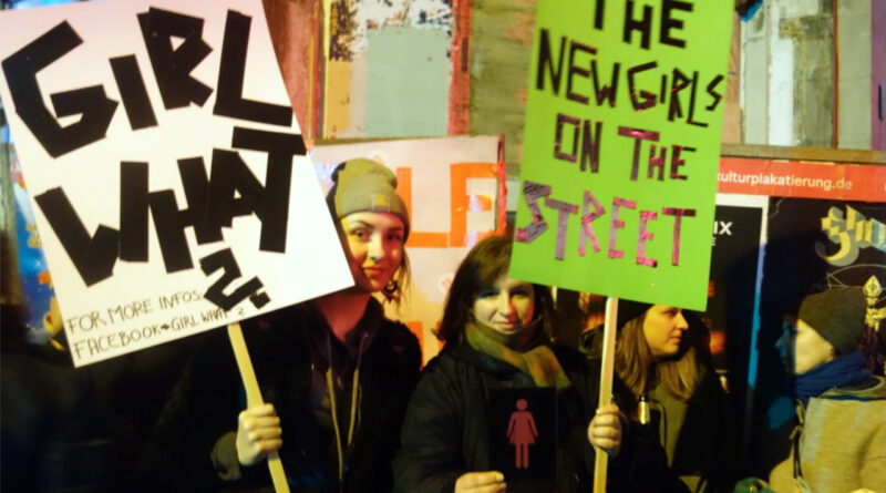 Activists of "Girl What" with poster "The New Girls On The Street" at the International Women's Day in Berlin 2017.