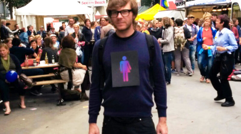 Paul Jonczyk with CO-WC sign at Lesbian and Gay City Festival in Berlin