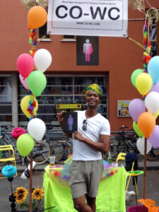 A person with a turban and the CO-WC sign at the Lesbian and Gay City Festival in Berlin.