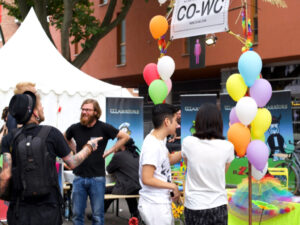 Group of people at the Lesbian and Gay City Festival at the CO-WC info booth.