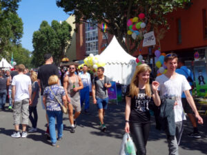 Motzstrasse with many visitors of the Lesbian and Gay City Festival and the CO-WC information booth.